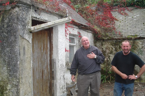 The Jimmys having a laugh outside the old house